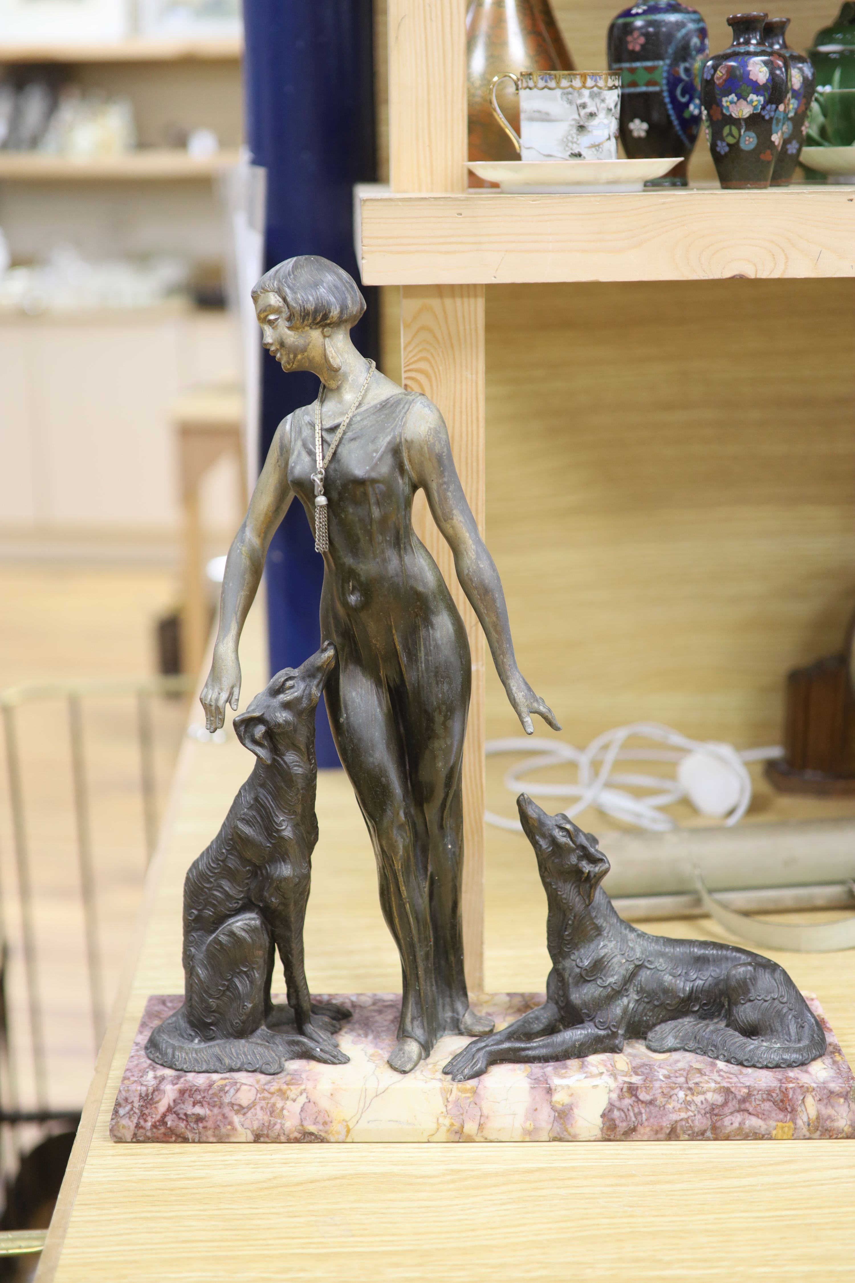 A Spelter Art Deco figure of a dog and borzoi, on a marble base, height 45cm